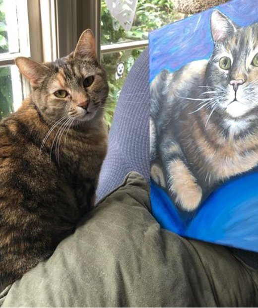 Real cat opposite of its painting portrait for PawsWithCause